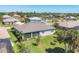 Aerial view of the home showcasing the spacious backyard, mature trees and neighborhood at 507 W Cashew, Punta Gorda, FL 33955