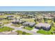 An elevated view showcasing the neighborhood with lush greenery, lakes, and well-spaced homes at 507 W Cashew, Punta Gorda, FL 33955