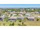 Sprawling neighborhood aerial view featuring single-Gathering homes, lush greenery, and well-maintained landscaping at 507 W Cashew, Punta Gorda, FL 33955
