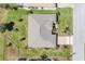 Aerial view of a single Gathering home with a large yard, mature landscaping, and a two car driveway at 507 W Cashew, Punta Gorda, FL 33955
