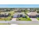 Aerial view of a beautiful home with a well-maintained lawn in a lush, green neighborhood at 507 W Cashew, Punta Gorda, FL 33955