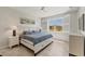 Bright bedroom with a large window, tile floors, and stylish furniture at 507 W Cashew, Punta Gorda, FL 33955