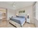 Comfortable bedroom featuring a queen size bed, tile floors, and a bright atmosphere at 507 W Cashew, Punta Gorda, FL 33955