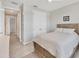 Bright bedroom features a comfortable bed, ceiling fan and double door closet at 507 W Cashew, Punta Gorda, FL 33955