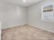 Neutral bedroom with tiled flooring, ceiling fan and large window at 507 W Cashew, Punta Gorda, FL 33955