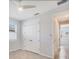 Neutral bedroom with tiled flooring, ceiling fan and double door closet at 507 W Cashew, Punta Gorda, FL 33955