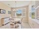 Inviting dining area with shuttered windows, natural light, and neutral décor at 507 W Cashew, Punta Gorda, FL 33955