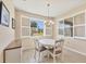 Cozy dining area with white table, shuttered windows, and natural light at 507 W Cashew, Punta Gorda, FL 33955