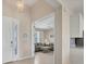 Bright foyer that leads into the living room with views of the open floor plan and tile floors at 507 W Cashew, Punta Gorda, FL 33955