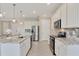 Modern kitchen with granite countertops, stainless steel appliances, and ample cabinet space at 507 W Cashew, Punta Gorda, FL 33955