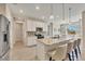 Spacious kitchen with stainless steel appliances, granite countertops, and a breakfast bar at 507 W Cashew, Punta Gorda, FL 33955