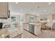 Well-lit kitchen with granite countertops, stainless steel appliances, and eat-in dining area at 507 W Cashew, Punta Gorda, FL 33955