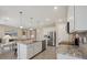 Open kitchen featuring granite countertops, stainless steel appliances, and seamless access to living areas at 507 W Cashew, Punta Gorda, FL 33955