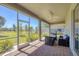 Relaxing screened patio with comfortable seating and beautiful backyard views at 507 W Cashew, Punta Gorda, FL 33955