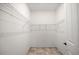 Spacious walk-in closet with ample shelving and neutral-colored tile flooring at 507 W Cashew, Punta Gorda, FL 33955