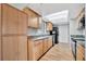 Kitchen with wood cabinets, granite countertops, stainless steel sink, and modern appliances at 5127 Island Date St, Sarasota, FL 34232