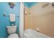 Cozy bathroom features a clean white bathtub, shower curtain, and a toilet at 5275 Willow Links # 50, Sarasota, FL 34235