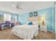 Inviting bedroom with a plush bed, a large window, and ample natural light at 5275 Willow Links # 50, Sarasota, FL 34235