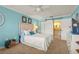 Serene bedroom featuring a plush bed, pastel walls, and an en-suite bathroom at 5275 Willow Links # 50, Sarasota, FL 34235