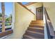 Inviting front entrance with stairs leading to the front door with a wreath at 5275 Willow Links # 50, Sarasota, FL 34235