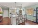 Spacious kitchen featuring an island with seating and views to other living spaces at 5275 Willow Links # 50, Sarasota, FL 34235