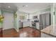 Well-lit kitchen with stainless steel appliances, white cabinets, and elegant granite countertops at 5275 Willow Links # 50, Sarasota, FL 34235