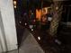 Outdoor landscape with palm trees and path lights creating a tranquil and inviting ambiance at 5378 Royal Palm Ave # 5378, Sarasota, FL 34234