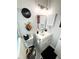Bathroom with white sink cabinet and decorative toilet seat at 5378 Royal Palm Ave # 5378, Sarasota, FL 34234