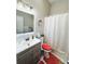 Renovated bathroom with gray sink cabinet and a shower curtain at 5378 Royal Palm Ave # 5378, Sarasota, FL 34234