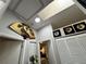Hallway featuring decorative fan with closet and bedroom access at 5378 Royal Palm Ave # 5378, Sarasota, FL 34234