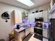 Compact kitchen with modern appliances, granite countertops, and a stylish backsplash offers a functional cooking space at 5378 Royal Palm Ave # 5378, Sarasota, FL 34234