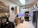 Compact kitchen featuring modern appliances, granite countertops, and a skylight offering ample natural light at 5378 Royal Palm Ave # 5378, Sarasota, FL 34234