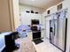 Well-lit kitchen with stainless steel appliances, granite countertops, and ample storage space for culinary enthusiasts at 5378 Royal Palm Ave # 5378, Sarasota, FL 34234