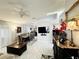 Spacious living and dining area with sleek tile flooring, modern furnishings, and abundant natural light at 5378 Royal Palm Ave # 5378, Sarasota, FL 34234