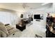 Living room featuring tile floors, modern furniture, and natural light creates a cozy atmosphere for relaxing and entertaining at 5378 Royal Palm Ave # 5378, Sarasota, FL 34234