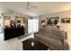 Cozy living room features tile flooring, a comfortable sofa, and tasteful décor, perfect for relaxation and entertaining guests at 5378 Royal Palm Ave # 5378, Sarasota, FL 34234