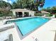 Community pool offers a refreshing escape, complemented by ample lounge seating and a covered area at 5378 Royal Palm Ave # 5378, Sarasota, FL 34234