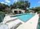 Sunny pool area with lounge chairs and covered pavilion for outdoor relaxation and entertainment at 5378 Royal Palm Ave # 5378, Sarasota, FL 34234