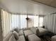 Sunroom featuring comfortable seating, soft lighting, and sheer curtains at 5378 Royal Palm Ave # 5378, Sarasota, FL 34234