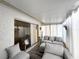 Inviting sunroom with cozy seating and bright, natural light at 5378 Royal Palm Ave # 5378, Sarasota, FL 34234