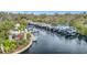 Aerial shot of a marina with multiple boat slips along a tranquil river, offering convenient access to waterways at 5508 Whitehead St, Bradenton, FL 34203