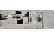 Bright kitchen with stainless steel appliances and white cabinetry at 5508 Whitehead St, Bradenton, FL 34203