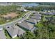 A neighborhood aerial view features ponds, sidewalks, and a view of several homes at 5621 Badini Way, Palmetto, FL 34221
