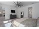Well-lit bedroom with a large ceiling fan, neutral tones, and ample closet space at 5621 Badini Way, Palmetto, FL 34221