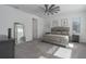 Bright bedroom with large windows, a ceiling fan, and neutral decor at 5621 Badini Way, Palmetto, FL 34221