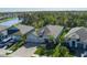A well-maintained home with an attached three car garage, landscaping, and lawn at 5621 Badini Way, Palmetto, FL 34221