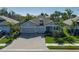 Lovely single-Gathering home with a paved driveway and lush tropical landscaping at 5621 Badini Way, Palmetto, FL 34221