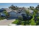 Landscaped front yard with a well-maintained home and brick driveway at 5621 Badini Way, Palmetto, FL 34221