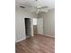 Spacious bedroom features neutral walls, fan, and wood-look flooring at 5681 Bentgrass Dr # 13-201, Sarasota, FL 34235