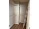 A walk-in closet with wire shelving and a modern laminate floor for storage at 5681 Bentgrass Dr # 13-201, Sarasota, FL 34235
